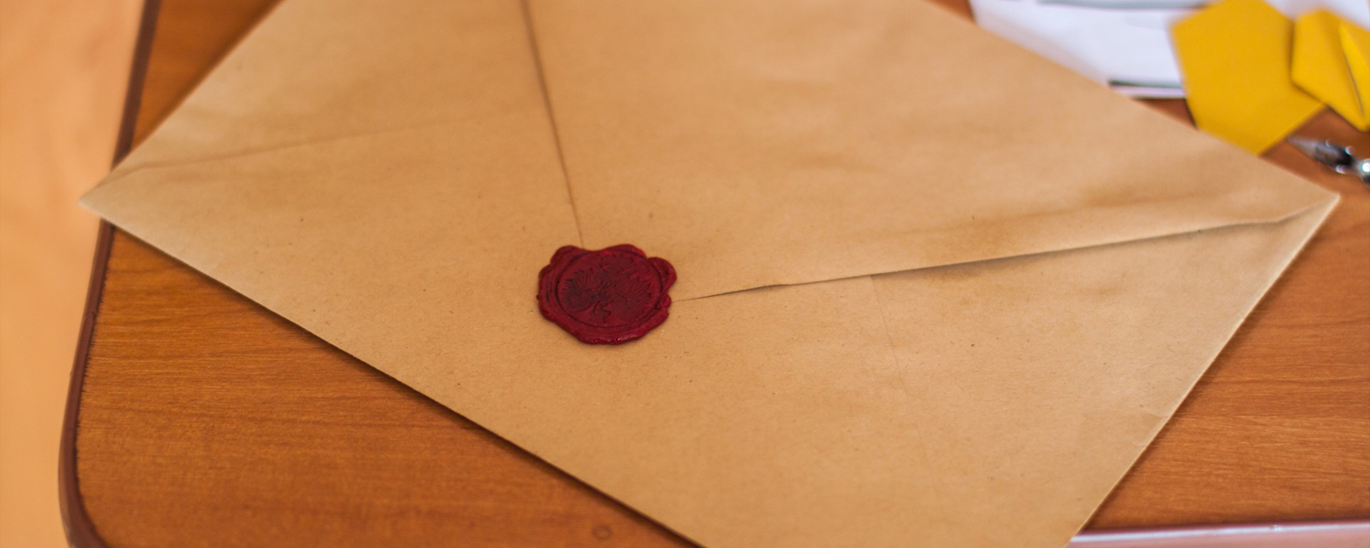 brown paper card with a red seal