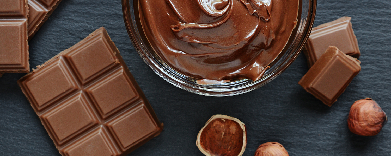 chocolate bar with chocolate dip and hazelnuts