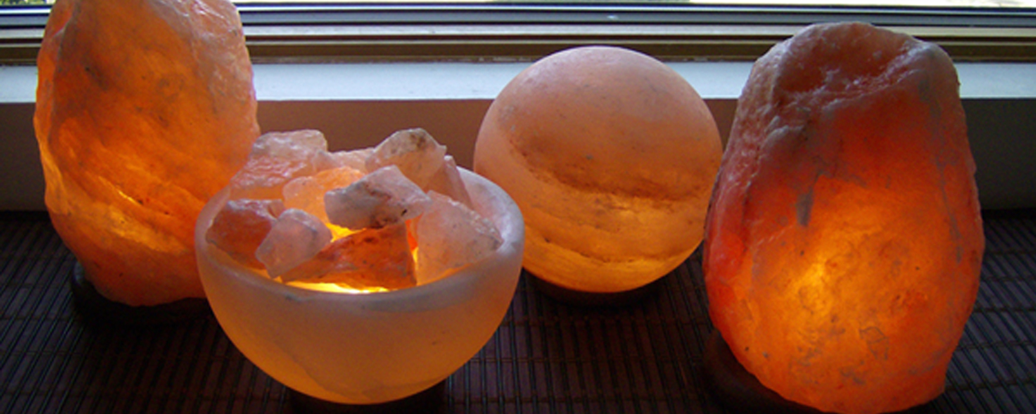 Himalayan Salt Lamps lined up by a window